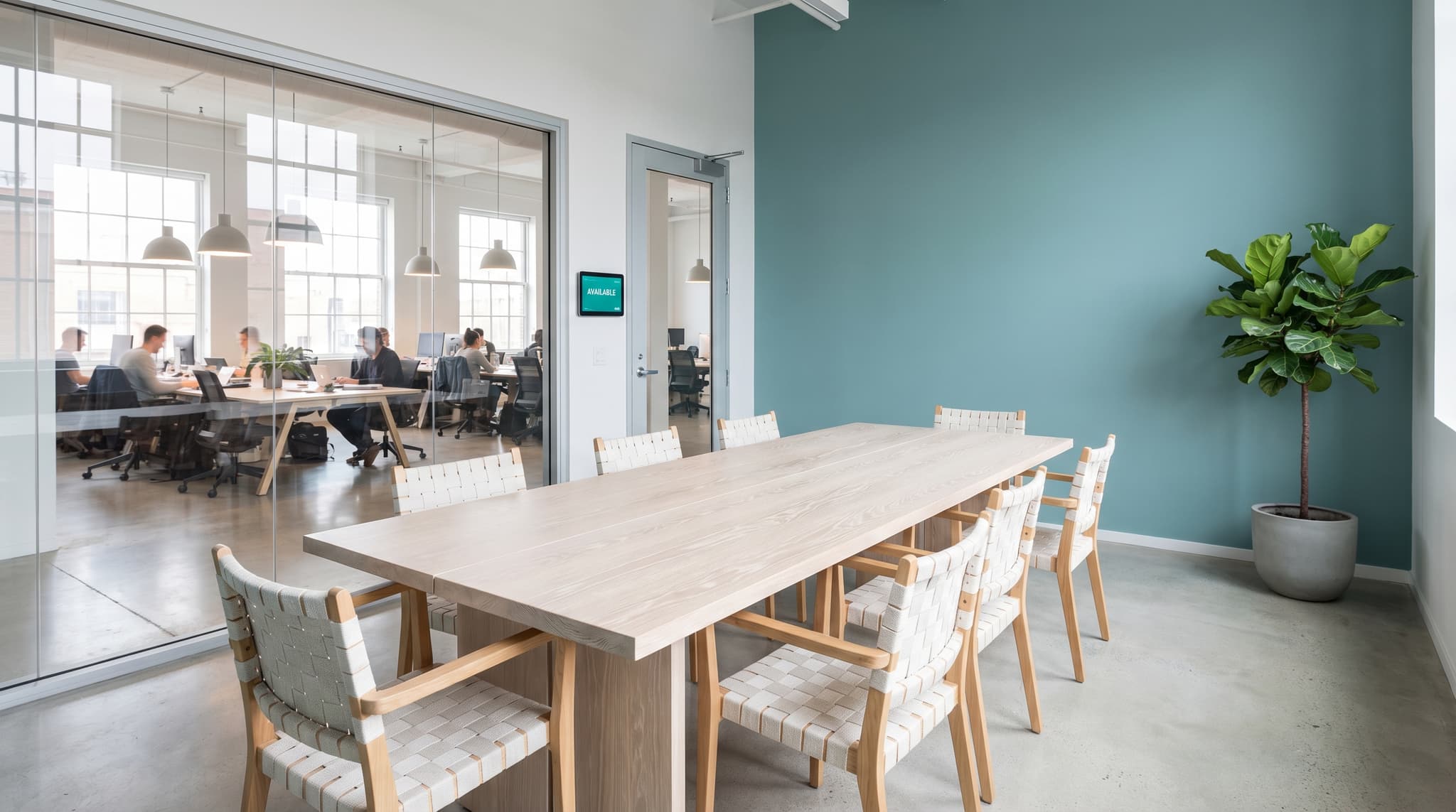 Modern Scandinavian meeting room with booking panel